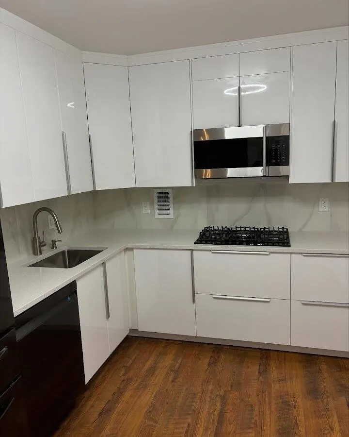 Restored kitchen with white cabinets after water damage in Cresskill
